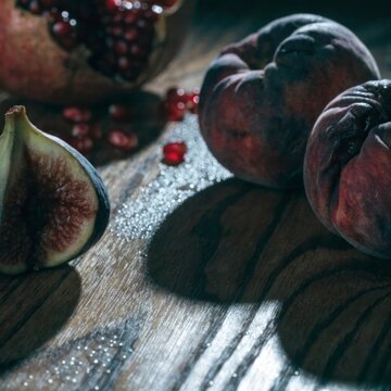 photorealistic still life of overripe fruit spli 