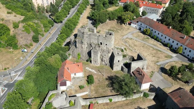 Aerial view of medieval Strekov castle ruins on basalt rock overlooking Usti nad Labem city in Czech Republic.