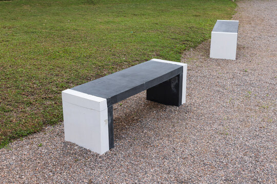 Modern backless park benches allow users to sit from either side. These benches come in durable materials  Concrete for resist weather and last a long time in public areas.