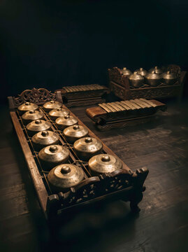 Gamelan ensemble with bonang barung hero on dark studio