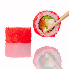 Chopsticks holding a salmon avocado sushi roll © Cavan