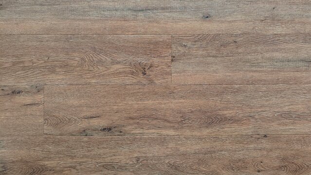 Natural weathered timber surface showcasing rich earthy brown and gray tones with authentic wood grain texture perfect for architectural design projects and interior decorating concepts