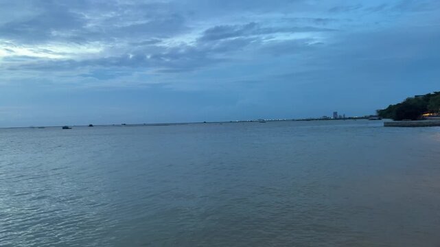 Slow panning view of the evening coast in Si Racha, Chonburi, Thailand