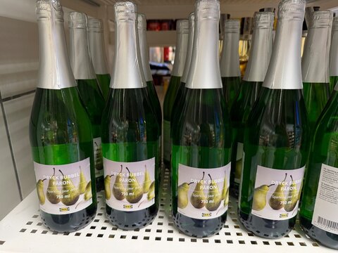 Mallorca, spain, july 09, 2026, ikea dryck bubbel paron sparkling pear drink bottles lining a supermarket shelf, ready for purchase, retail display