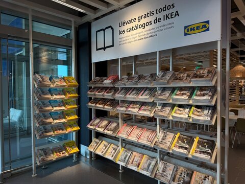 Mallorca, spain, july 09, 2026, ikea store entrance displaying furniture catalogs and home decor booklets in a magazine rack with spanish signage