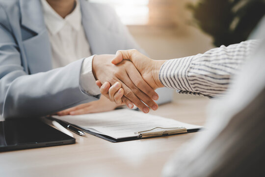 Partners corporate relationship concept. Close up handshake of business people in meeting attendance.
