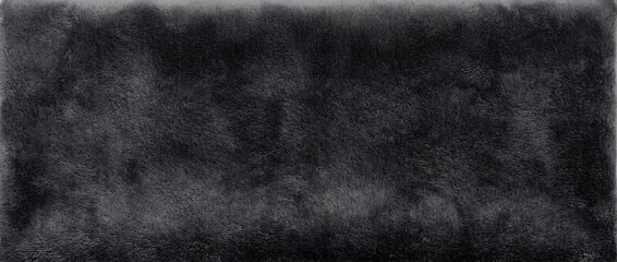 Black fur background featuring a softly textured plush surface with fine fibers and gentle shadows for cozy luxurious designs © Vexello