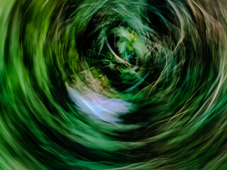 Psychedelic abstract fluid wave texture in green and purple colors © Nashrullah