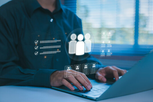 Businessman using a laptop with a virtual human resources interface, representing recruitment, employee management, talent acquisition, workforce planning, digital HR technology, and team management.