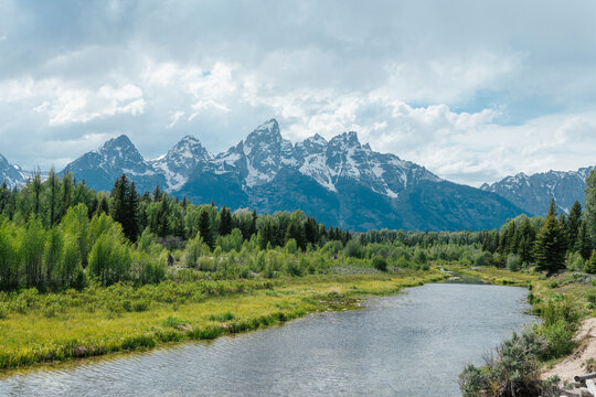 Winding river flowing towards the Teton mountain range.