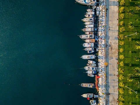 Aerial top down view of boats docked in a marina