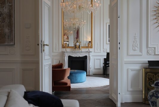 View through open doors into elegant Parisian apartment
