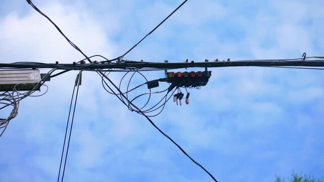 Fiber optic splice closure box on aerial utility line grid