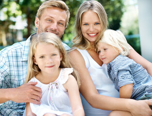 Fototapeta premium Happy, parents and kids with love in backyard for weekend break, bonding together and support. Care, people and children portrait in home garden for family connection, healthy relationship and trust