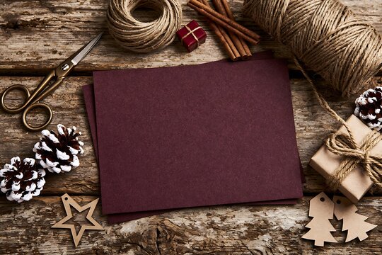 Blank dark red greeting card mockup on rustic winter background