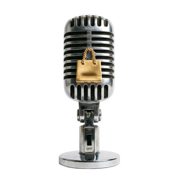 Vintage microphone with a small golden shopping bag hanging on it isolated on transparent background