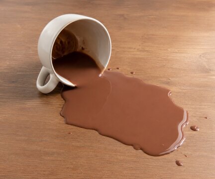 a spilled glass of chocolate