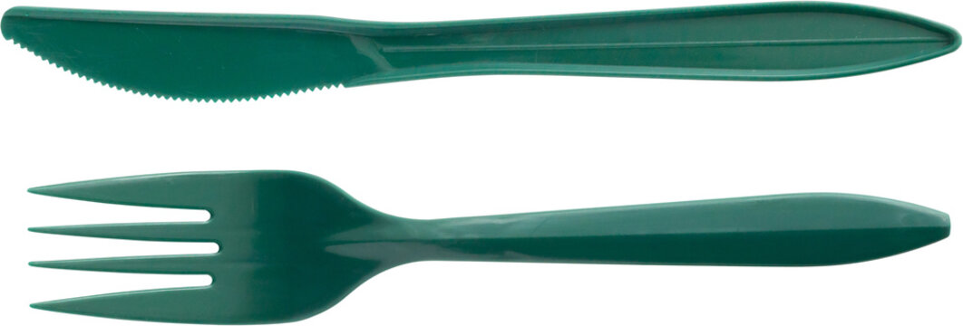 Green plastic fork and knife isolated on white background