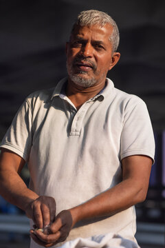Male vendor making dough at his roadside food stall