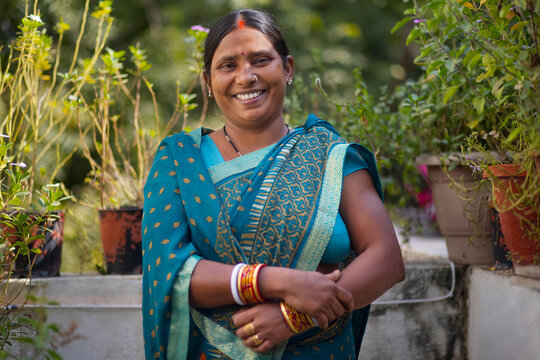 portrait of a smiling  indian house maid 