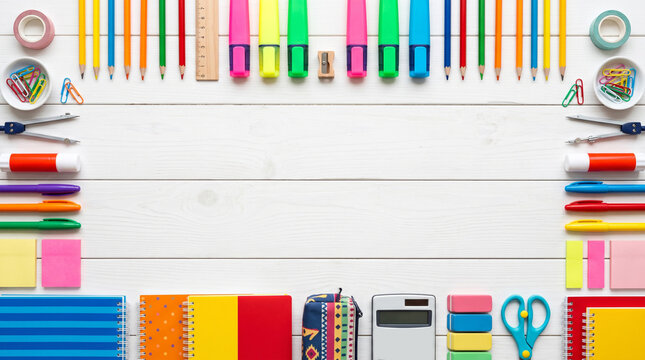 Back to school supplies neatly arranged on wooden desk. Vibrant stationery set for students and office organization.