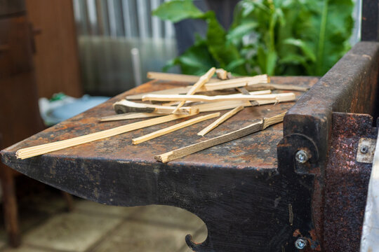 Fresh wooden kindling prepared for starting barbecue fire outdoors