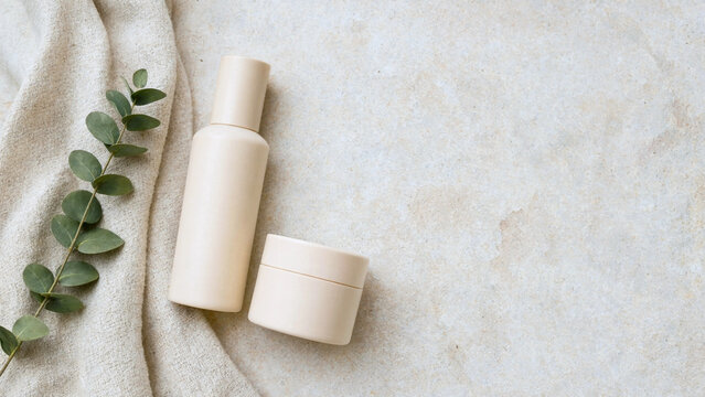 A serene arrangement of natural skincare products on a soft surface