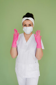 Happy Doctor In Mask Showing Pink Gloves