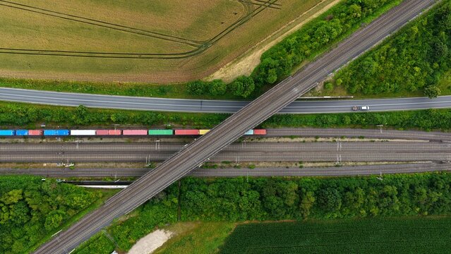 Aerial View of Freight Train, Railway Flyover and Rural Road