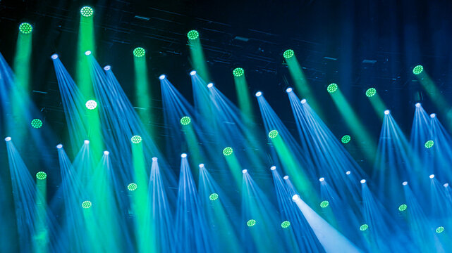 background of fiber optics background with lots light spots in blue and green 