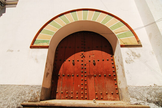 Bolivia, Copacabana, low angle view of an arch entrance with nailed closed door