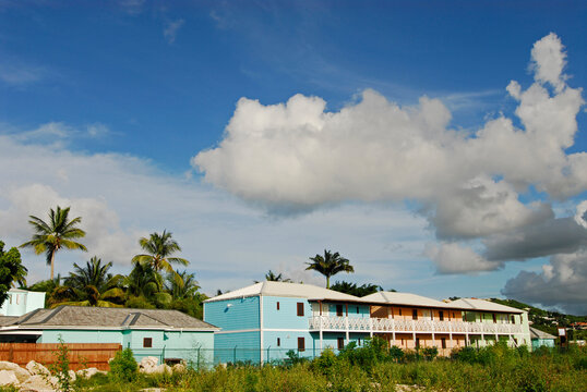Antigua, Dickenson Bay, image of colorful houses in a row against clear sky