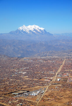 Bolivia, El Alto, aerial view of one of the world's highest cities of El Alto, set at the foot of the Illimani mountain, the Guardian of la Paz, with its eternal snows