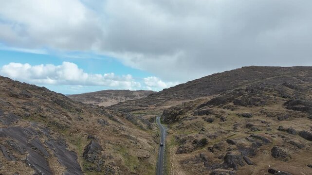 Epic Irish Landscapes and road trips car climbing The Healey pass from Kerry side vista opens up dramatic Wild Atlantic Way
