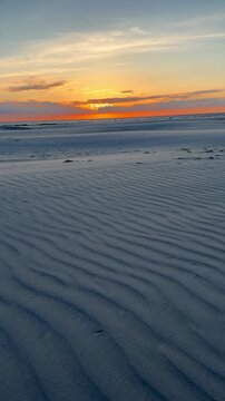 romantic sunset at the sandy beach