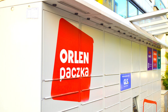 Modern automated parcel locker terminal Orlen Paczka for convenient self-service shipping and package pickup on a city street