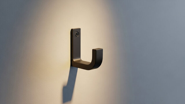 Modern bronze wall hook with sleek design and minimalist aesthetic for home decor and organization purposes.