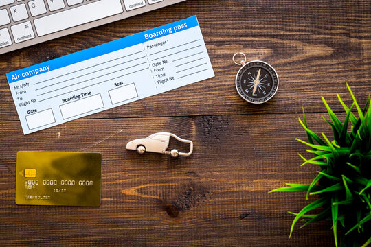 tourist outfit, card, tickets for travelling on wooden background top view