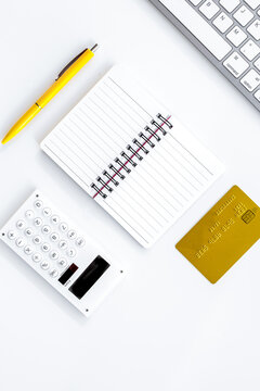 online purchasing with credit cards and notebook white manager desk background top view mock-up