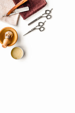 Tools beard and moustaches' care. Razor, brush and sciccors on white background top view copy space