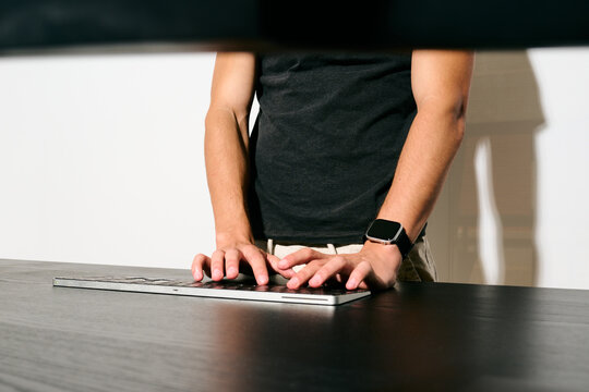 Hands typing on keyboard