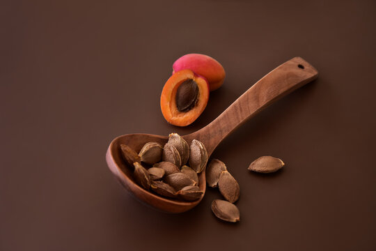 Apricot kernels in a wooden ladle