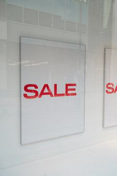 Corby, Northamptonshire, United Kingdom - July 15, 2026: Sale sign in retail shop window with copy space