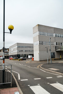 Corby, Northamptonshire, United Kingdom - July 15, 2026: Urban street with office buildings and Belisha beacons in Corby town centre