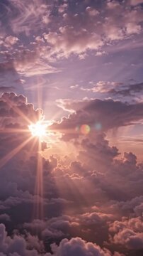 Sun rays shine through clouds in a magenta purple sunrise sky