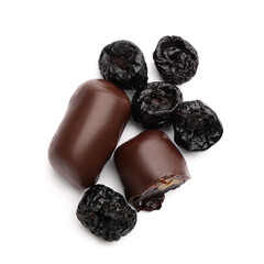 Naklejka premium Sweet chocolate covered prunes on white background