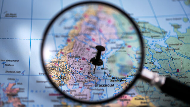 G&Auml;VLE on paper map with magnifying glass and push pin