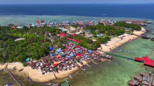 Luxury Resort on a Beautiful Mabul Island. Blue sea with a coral reef and the beach, Aerial. Semporna, Sabah, Malaysia.