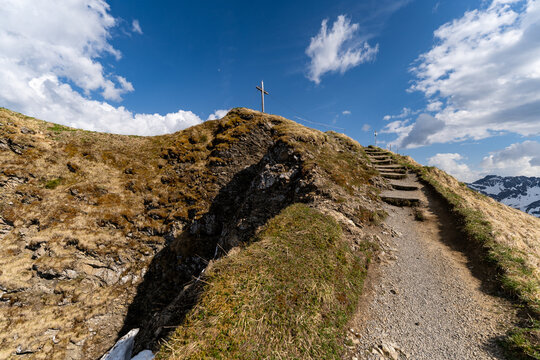 Mountain hiking trail to the Fellhorn summit cross in Germany