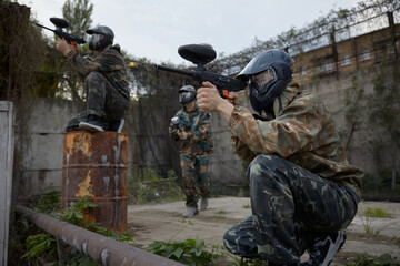 Fototapeta premium Group of soldiers take defensive positions and preparing for the attack during tactical training